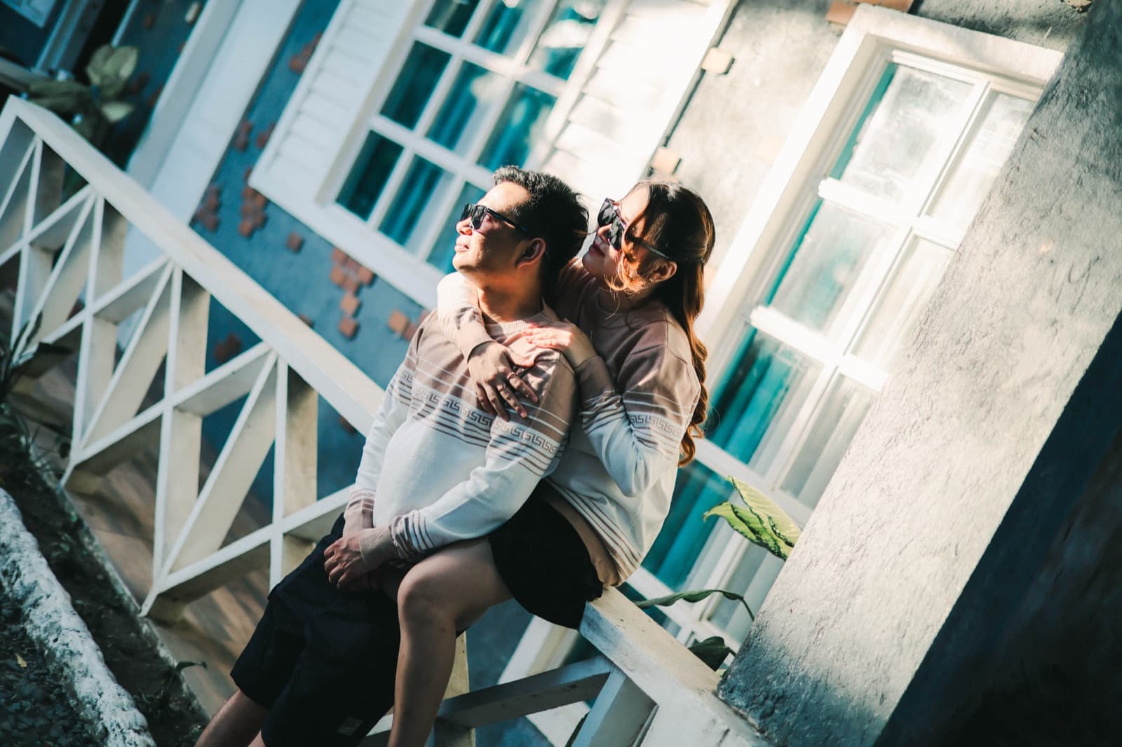 A candid laugh on the old wooden steps