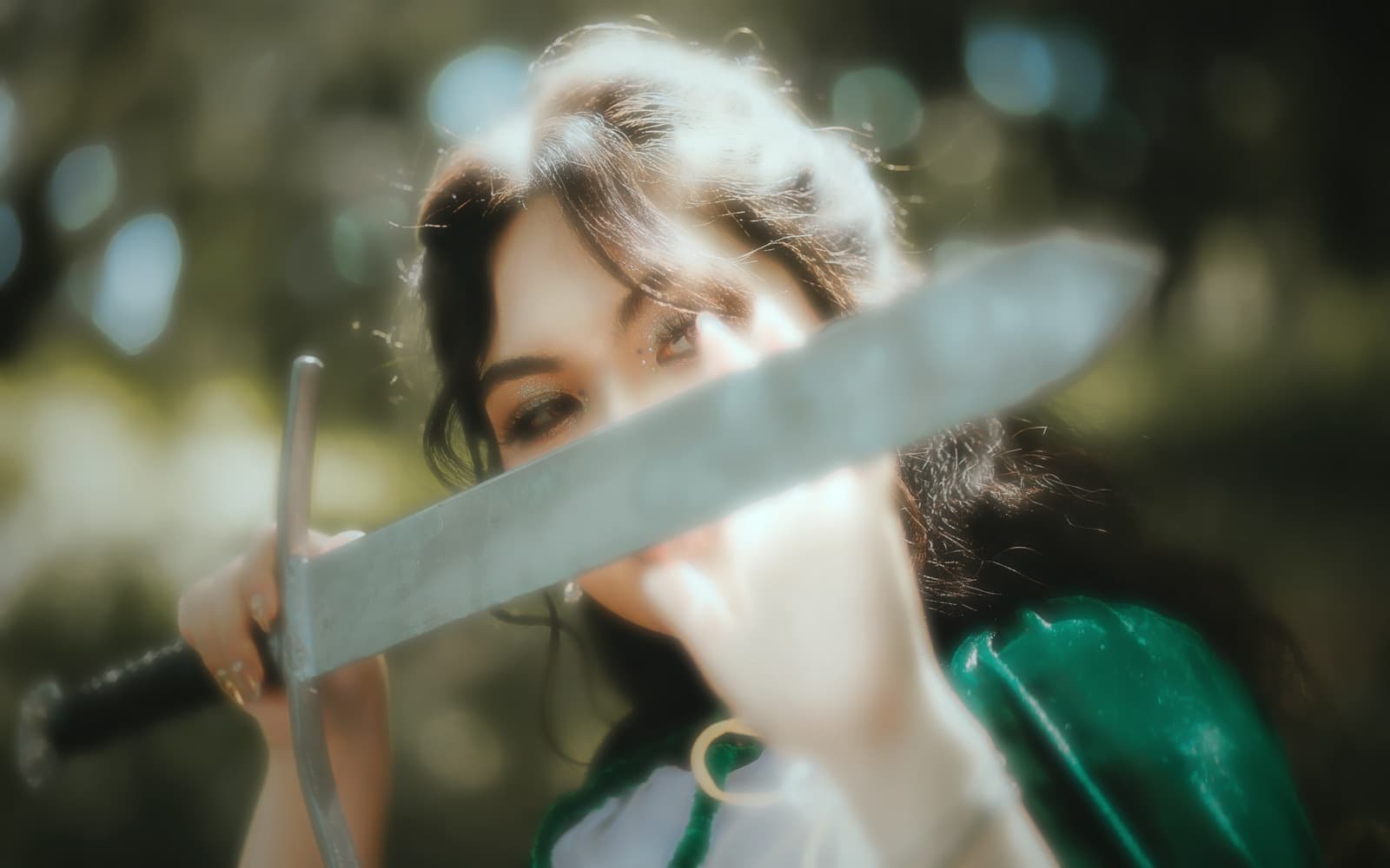 The huntress, blade catching the light
