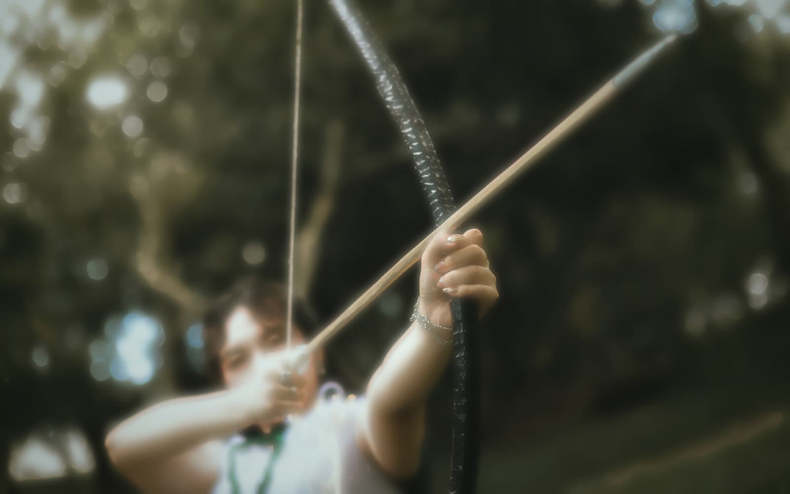 Drawing the bow, mid-action