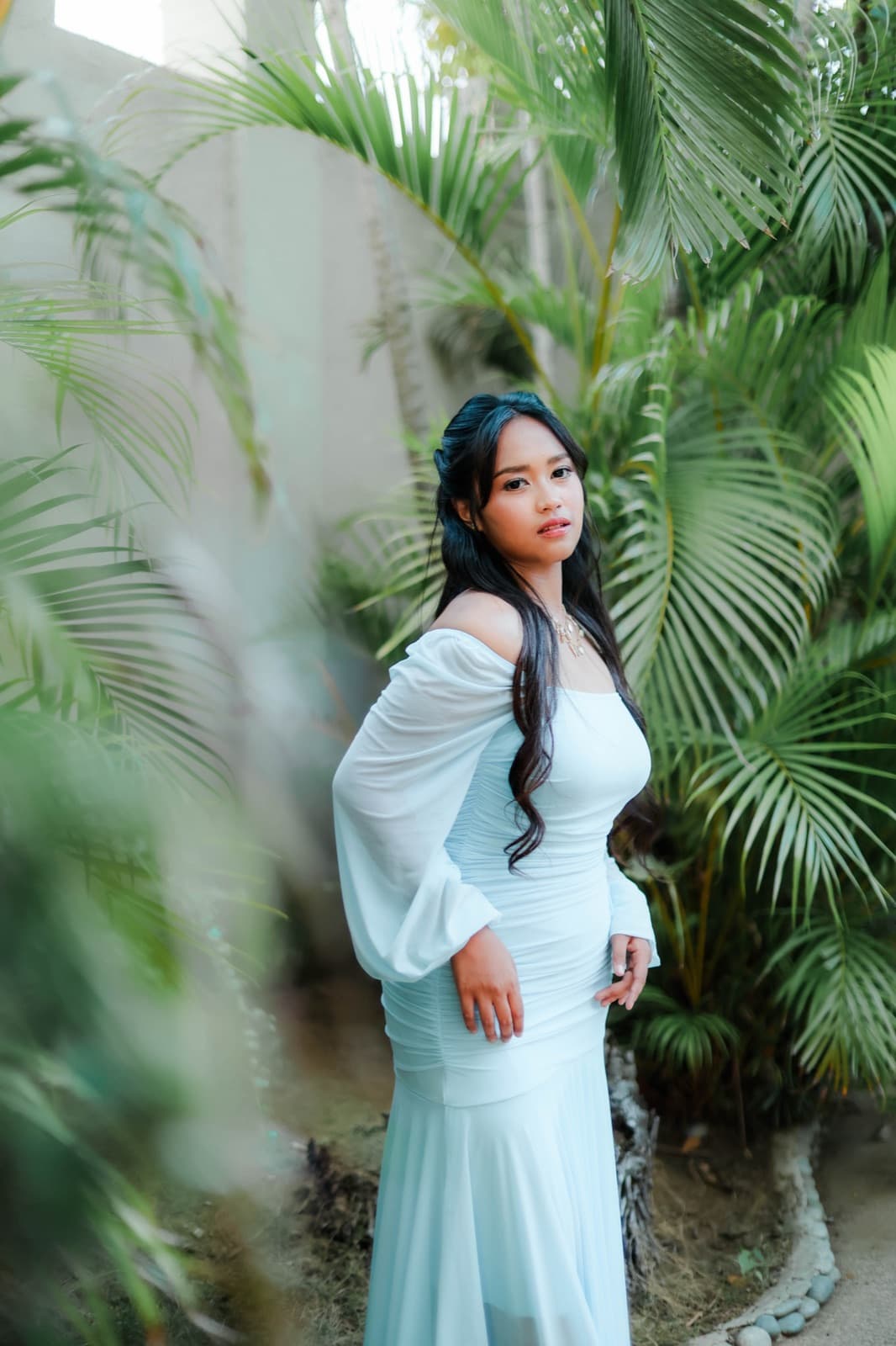 Among the palms in pale blue